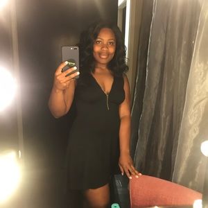 Monteau High-low little black dress with zip front & leatherette detail.